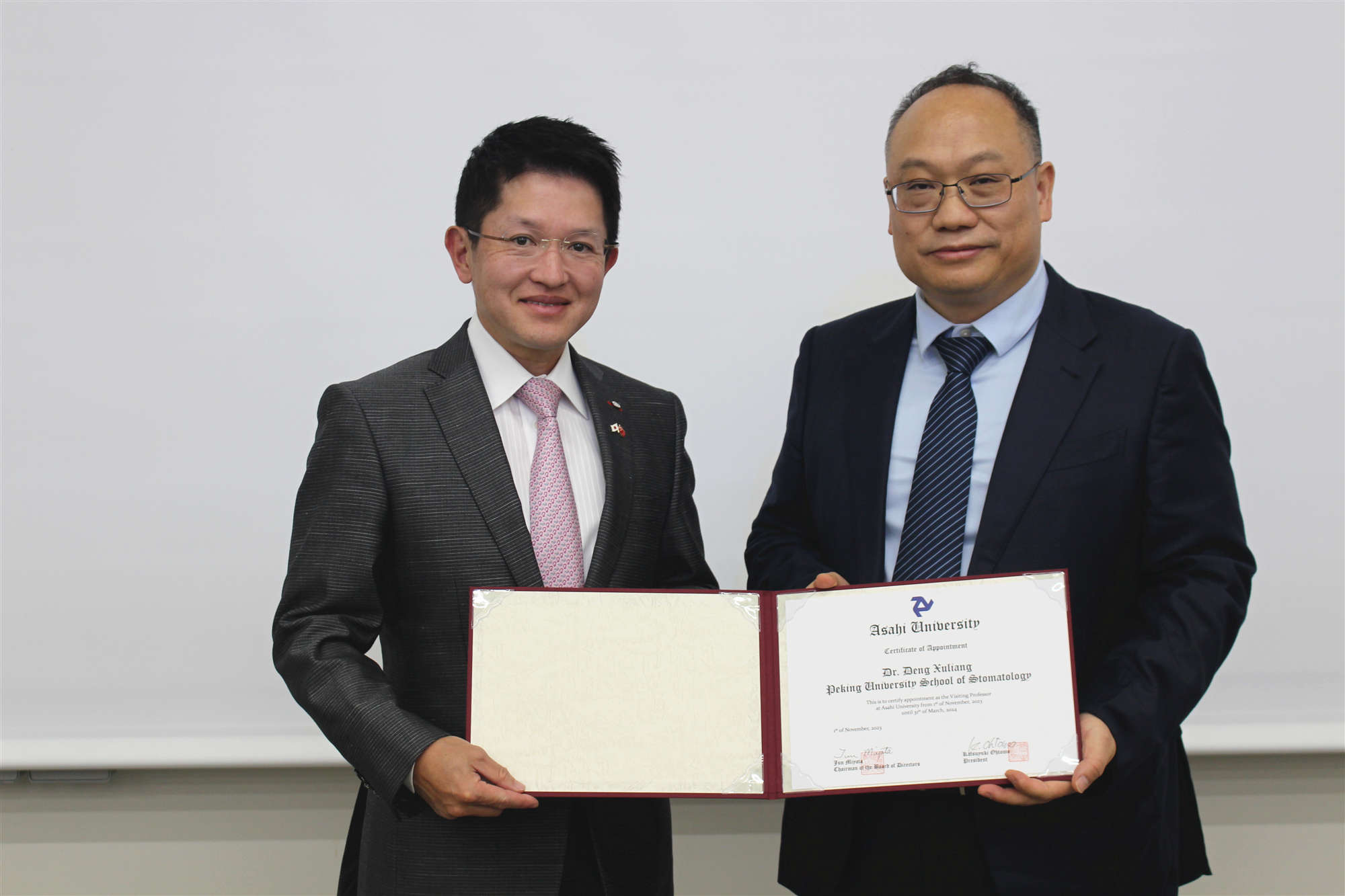 邓旭亮教授受聘为日本朝日大学和明海大学客座教授